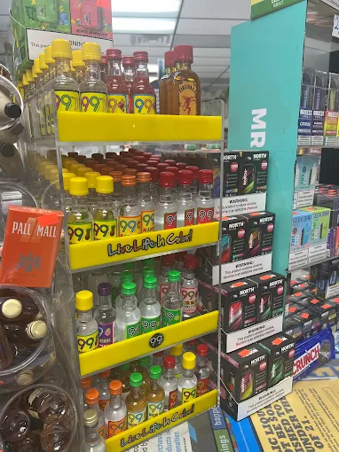 Colorful miniature liquor bottles and vape products on display