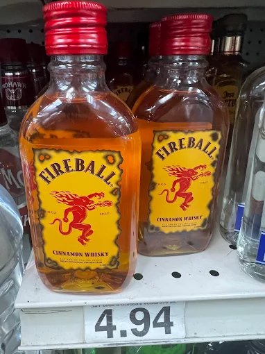 Jack Daniel’s Tennessee Whiskey bottles and Apple whiskey on a shelf