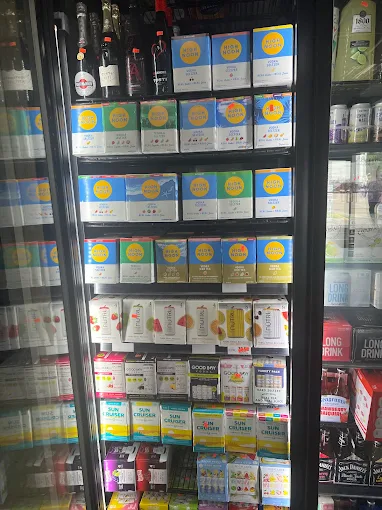 Shelf of summer beverage mix boxes and cocktails